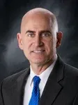 Photo of John P. Guzik, Plaintiff Lawyer